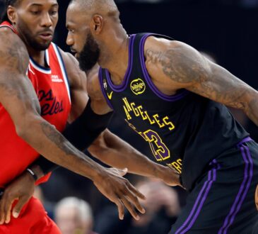 LeBron James #23 of the Los Angeles Lakers controls the ball against Kawhi Leonard #2 of the Los Angeles Clippers at Intuit Dome on January 22, 2026.