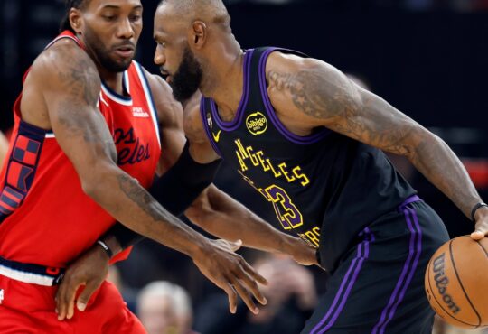 LeBron James #23 of the Los Angeles Lakers controls the ball against Kawhi Leonard #2 of the Los Angeles Clippers at Intuit Dome on January 22, 2026.