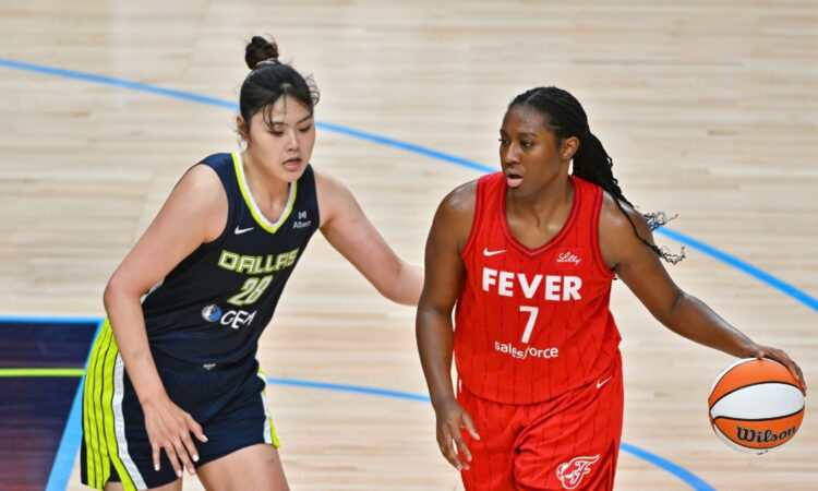 Dallas Wings center Li Yueru defends Indiana Fever center Aliyah Boston in the post during a game at American Airlines Center.