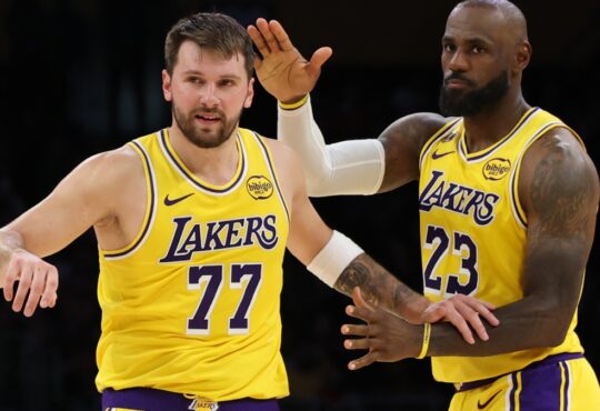 LeBron James congratulating Luka Dončić after his 51-point performance and record-breaking three-pointer during the Lakers vs. Bulls game at Crypto.com Arena.