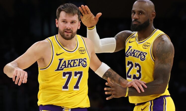 LeBron James congratulating Luka Dončić after his 51-point performance and record-breaking three-pointer during the Lakers vs. Bulls game at Crypto.com Arena.