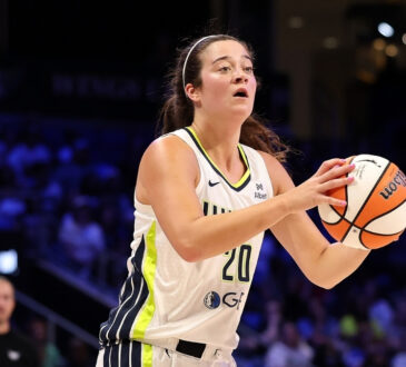 Maddy Siegrist #20 of the Dallas Wings takes a jump shot during a game against the Connecticut Sun in Arlington.