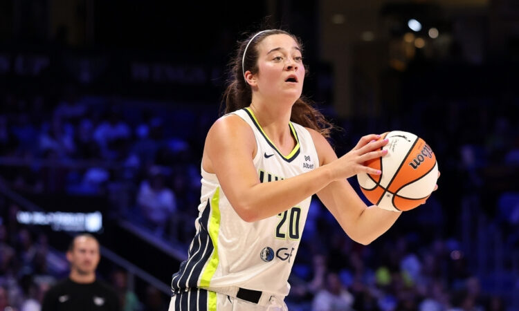 Maddy Siegrist #20 of the Dallas Wings takes a jump shot during a game against the Connecticut Sun in Arlington.