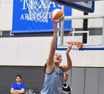 Dallas Wings forward Maddy Siegrist elevates for a layup during a training camp practice session at College Park Center.