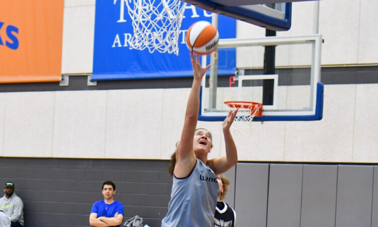 Dallas Wings forward Maddy Siegrist elevates for a layup during a training camp practice session at College Park Center.