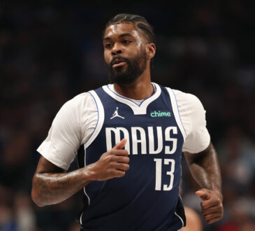 Naji Marshall #13 of the Dallas Mavericks runs up the court during a home game against the Golden State Warriors at American Airlines Center.