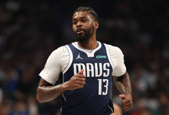 Naji Marshall #13 of the Dallas Mavericks runs up the court during a home game against the Golden State Warriors at American Airlines Center.