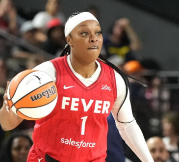 Odyssey Sims #1 of the Indiana Fever dribbles the ball during a WNBA game against the Washington Mystics in Baltimore.