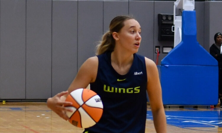 Dallas Wings star Paige Bueckers dribbles the ball up the floor while surveying the defense during a 5-on-5 scrimmage at College Park Center.
