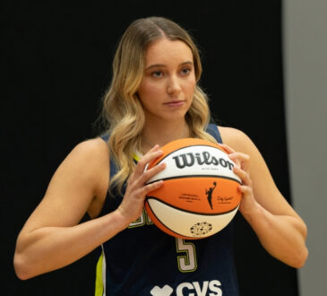 Dallas Wings guard Paige Bueckers poses with a basketball during the team’s 2026 Media Day at College Park Center.