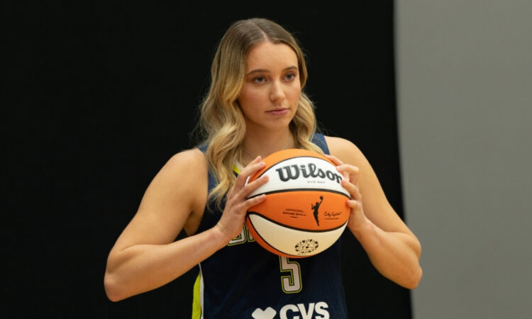 Dallas Wings guard Paige Bueckers poses with a basketball during the team’s 2026 Media Day at College Park Center.