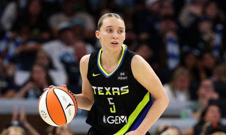 Dallas Wings guard Paige Bueckers handles the ball against the Minnesota Lynx at Target Center in Minneapolis.