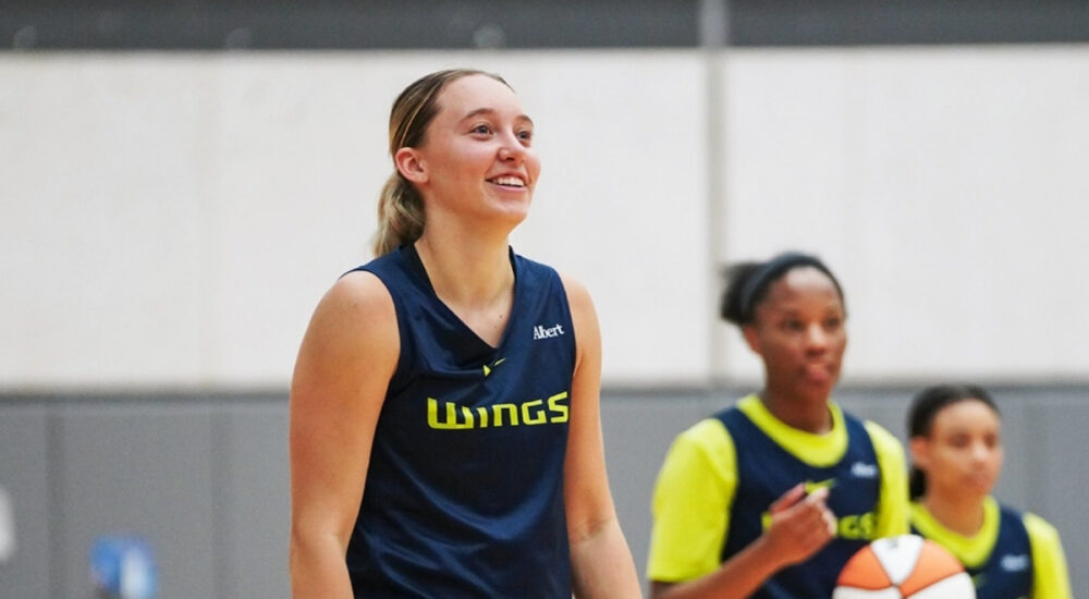 Dallas Wings guard Paige Bueckers handles the ball during a team drill on the opening day of 2026 training camp in Arlington.