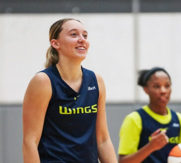 Dallas Wings guard Paige Bueckers handles the ball during a team drill on the opening day of 2026 training camp in Arlington.