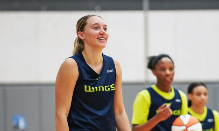 Dallas Wings guard Paige Bueckers handles the ball during a team drill on the opening day of 2026 training camp in Arlington.