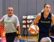 Dallas Wings star Paige Bueckers handles the ball in transition while head coach Jose Fernandez watches from the sideline at College Park Center.