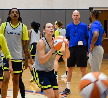 Dallas Wings guard Paige Bueckers taking a jump shot during a team shooting drill at a 2026 training camp practice in Arlington.