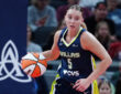 Dallas Wings guard Paige Bueckers brings the ball up court against the Indiana Fever during a preseason game at Gainbridge Fieldhouse.