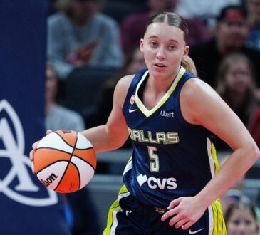 Dallas Wings guard Paige Bueckers brings the ball up court against the Indiana Fever during a preseason game at Gainbridge Fieldhouse.