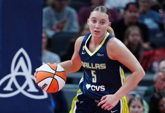 Dallas Wings guard Paige Bueckers brings the ball up court against the Indiana Fever during a preseason game at Gainbridge Fieldhouse.