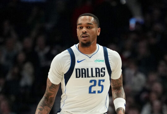 P.J. Washington #25 of the Dallas Mavericks dribbles against the Portland Trail Blazers during the first half at Moda Center on March 27, 2026.