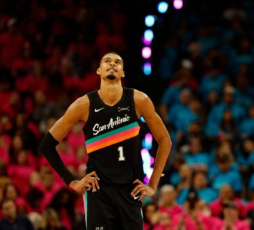 Victor Wembanyama #1 of the San Antonio Spurs looks at the clock during Game 1 of the Western Conference First Round against the Portland Trail Blazers at Frost Bank Center on April 19, 2026.