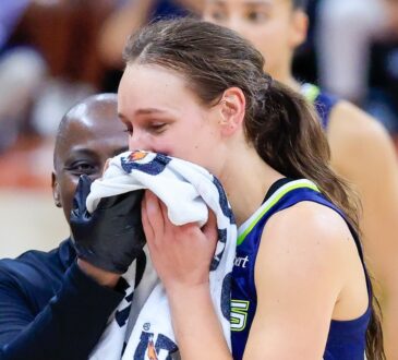Alanna Smith of the Dallas Wings walks off the court with a facial injury during the preseason finale against the Las Vegas Aces in Austin.