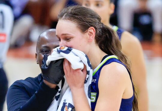 Alanna Smith of the Dallas Wings walks off the court with a facial injury during the preseason finale against the Las Vegas Aces in Austin.