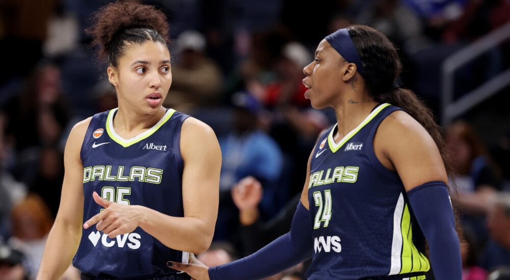 Veteran guard Arike Ogunbowale and rookie guard Azzi Fudd conferring on the floor during the second half of a game against the Chicago Sky.
