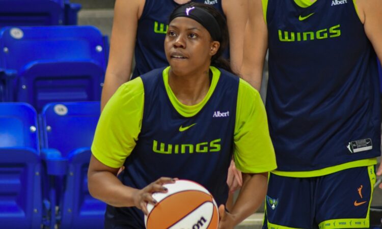 Arike Ogunbowale handles the ball during a 5-on-5 drill at Dallas Wings practice.