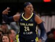 Arike Ogunbowale celebrates after making a three-pointer for the Dallas Wings.