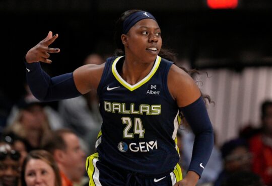 Arike Ogunbowale celebrates after making a three-pointer for the Dallas Wings.