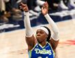 Arike Ogunbowale of the Dallas Wings rising for a jump shot during the 2026 home opener against the Atlanta Dream.