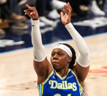 Arike Ogunbowale of the Dallas Wings rising for a jump shot during the 2026 home opener against the Atlanta Dream.
