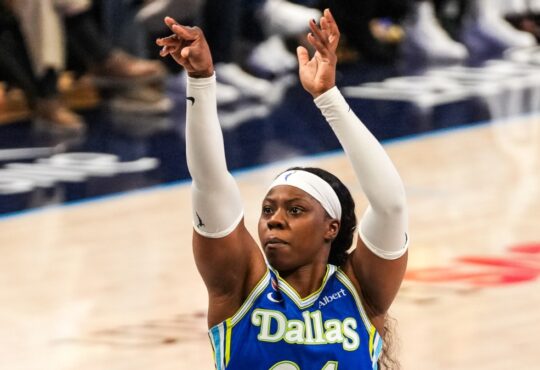 Arike Ogunbowale of the Dallas Wings rising for a jump shot during the 2026 home opener against the Atlanta Dream.