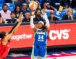 Arike Ogunbowale of the Dallas Wings rises for a contested jump shot against the Atlanta Dream during the 2026 home opener.