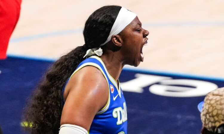 Arike Ogunbowale of the Dallas Wings roaring toward the sellout crowd at College Park Center during the home opener.