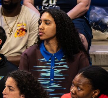 Dallas Wings rookie Azzi Fudd watching from the bench during the 2026 home opener against the Atlanta Dream.