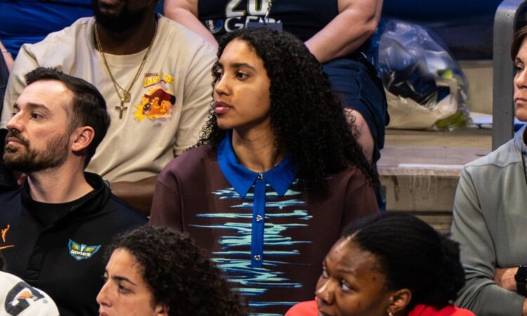 Dallas Wings rookie Azzi Fudd watching from the bench during the 2026 home opener against the Atlanta Dream.