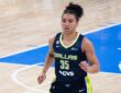 Azzi Fudd on the court in her Dallas Wings uniform during a game against the Chicago Sky.