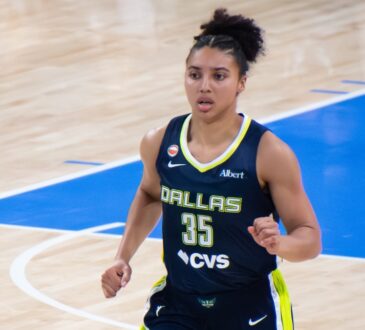 Azzi Fudd on the court in her Dallas Wings uniform during a game against the Chicago Sky.