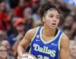 Azzi Fudd (35) of the Dallas Wings looks to make a play during her WNBA regular-season debut against the Indiana Fever.
