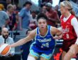 Azzi Fudd (35) of the Dallas Wings drives to the basket against Sophie Cunningham (8) of the Indiana Fever.