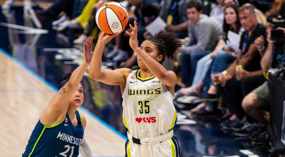 Rookie guard Azzi Fudd pulling up for a mid-range jump shot along the wing during a home matchup at College Park Center.