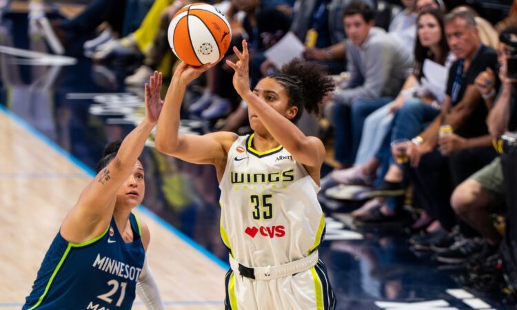 Rookie guard Azzi Fudd pulling up for a mid-range jump shot along the wing during a home matchup at College Park Center.