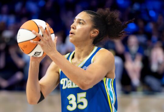 Rookie guard Azzi Fudd of the Dallas Wings rising for a mid-range pull-up jump shot against the Washington Mystics at College Park Center.
