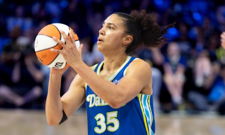 Rookie guard Azzi Fudd of the Dallas Wings rising for a mid-range pull-up jump shot against the Washington Mystics at College Park Center.