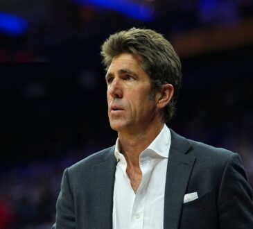 Bob Myers watching the Eastern Conference first round playoff game between the Boston Celtics and Philadelphia 76ers at Xfinity Mobile Arena.