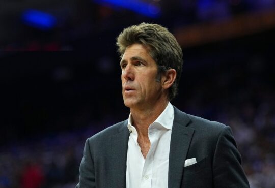 Bob Myers watching the Eastern Conference first round playoff game between the Boston Celtics and Philadelphia 76ers at Xfinity Mobile Arena.