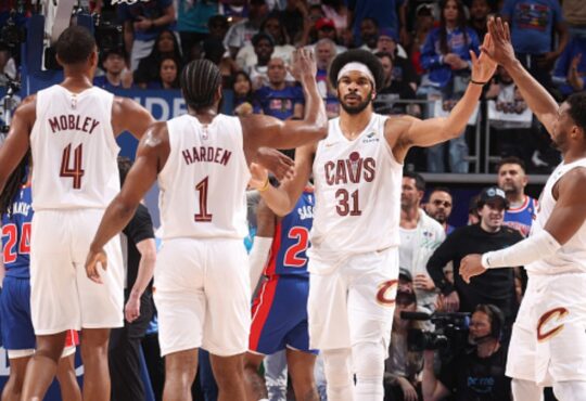 Evan Mobley #4, James Harden #1, Jarrett Allen #31, and Donovan Mitchell #45 of the Cleveland Cavaliers celebrate during Game 7 of the Eastern Conference Second Round playoffs against the Detroit Pistons at Little Caesars Arena on May 17, 2026.